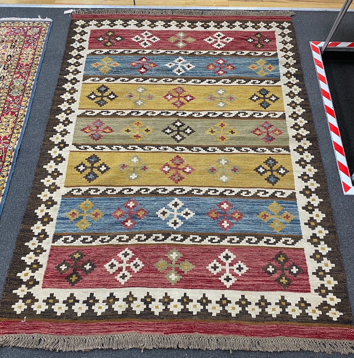 A Kilim polychrome flat weave carpet, 240 x 170cm